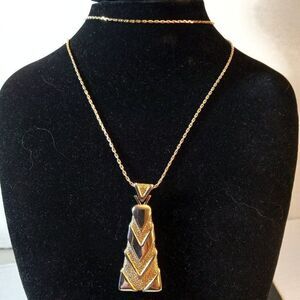 Direction One gold tone chain and Triangular Pendant